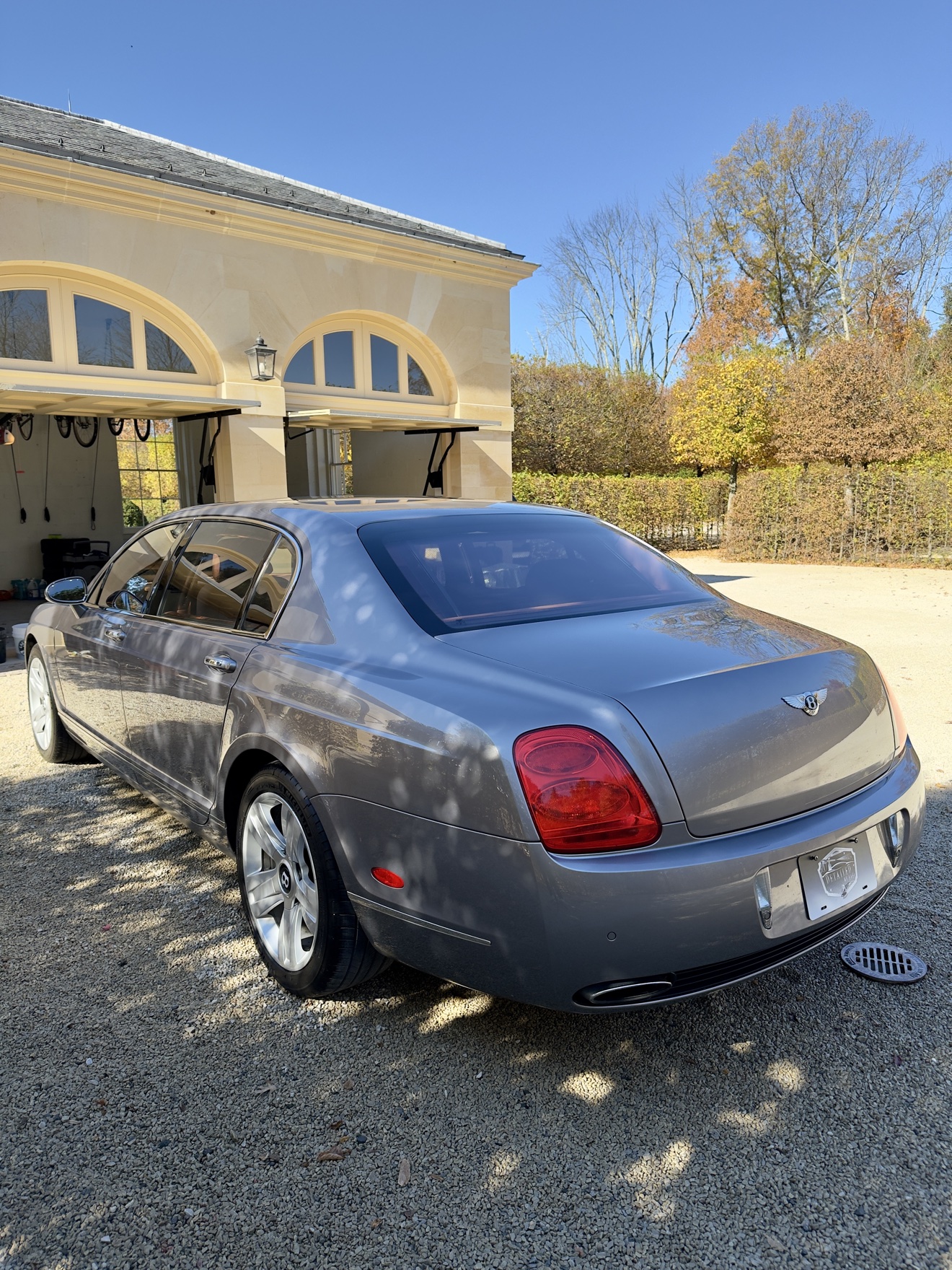 Silver Bentley Continental rear three-quarter view after detailing