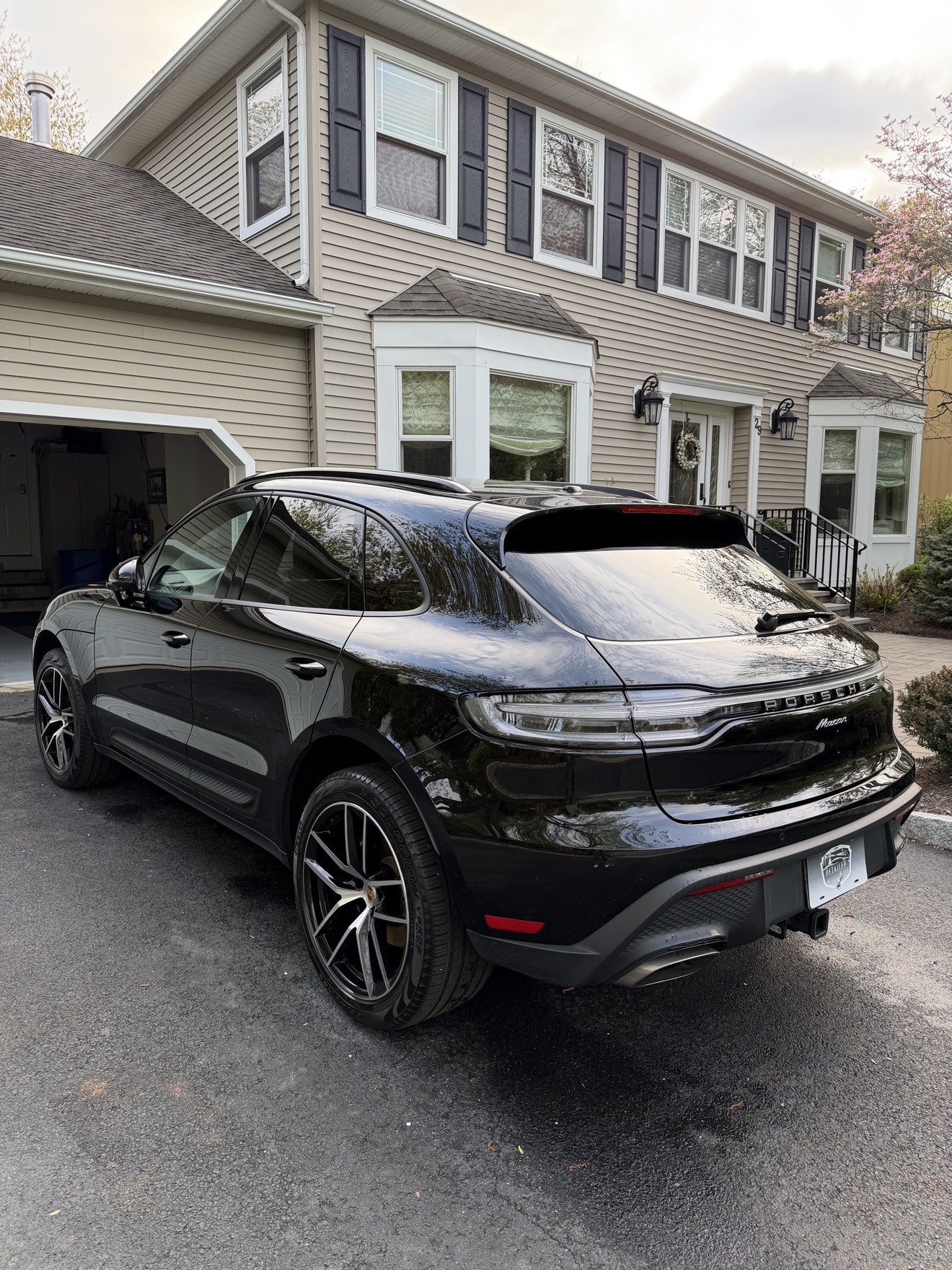 Black Porsche Macan rear angle view after detailing