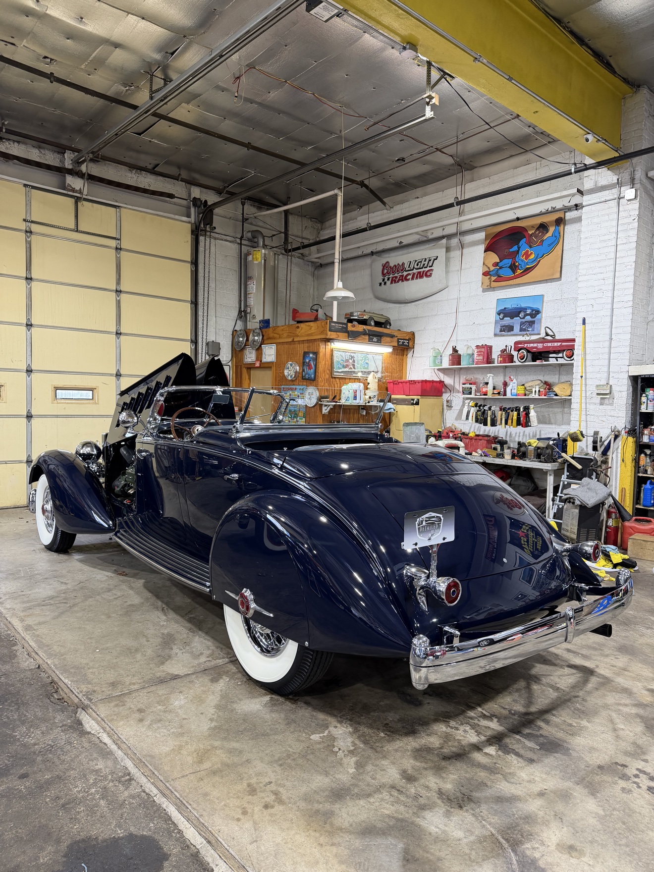 1934 Packard Twelve rear three-quarter view with hood open after detailing