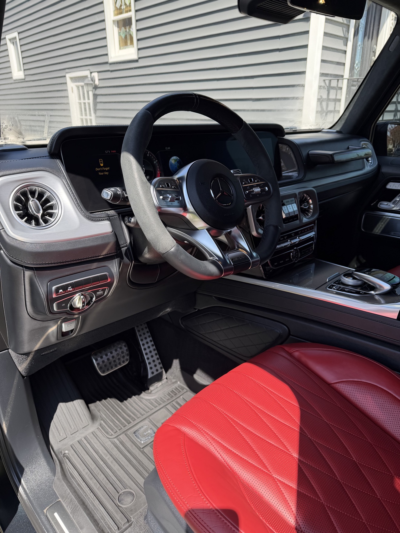 G 63 driver cockpit with red leather seats after detailing