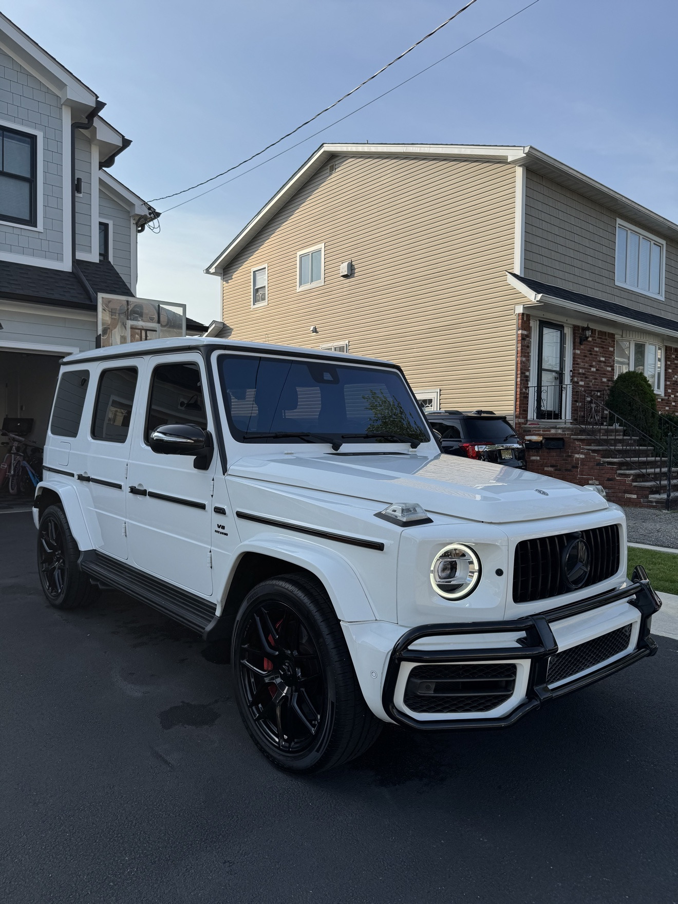 White Mercedes-Benz G-Wagon after detailing in a driveway