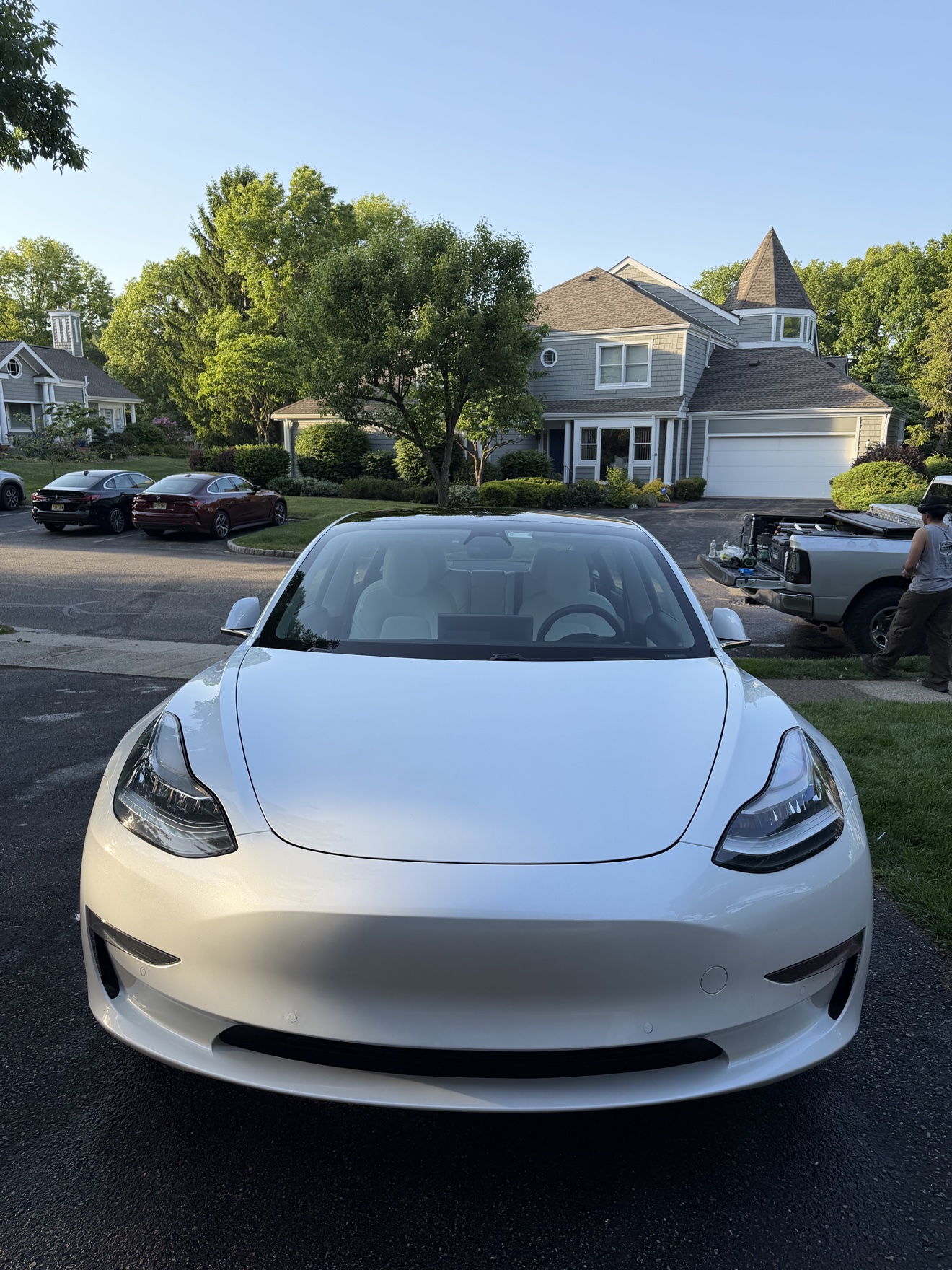 Front view of a white Tesla Model 3 after detailing