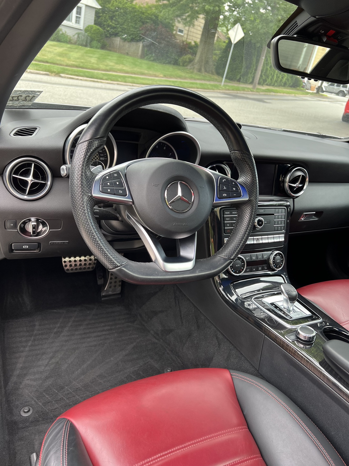 Detailed Mercedes interior with red and black leather seats and dashboard