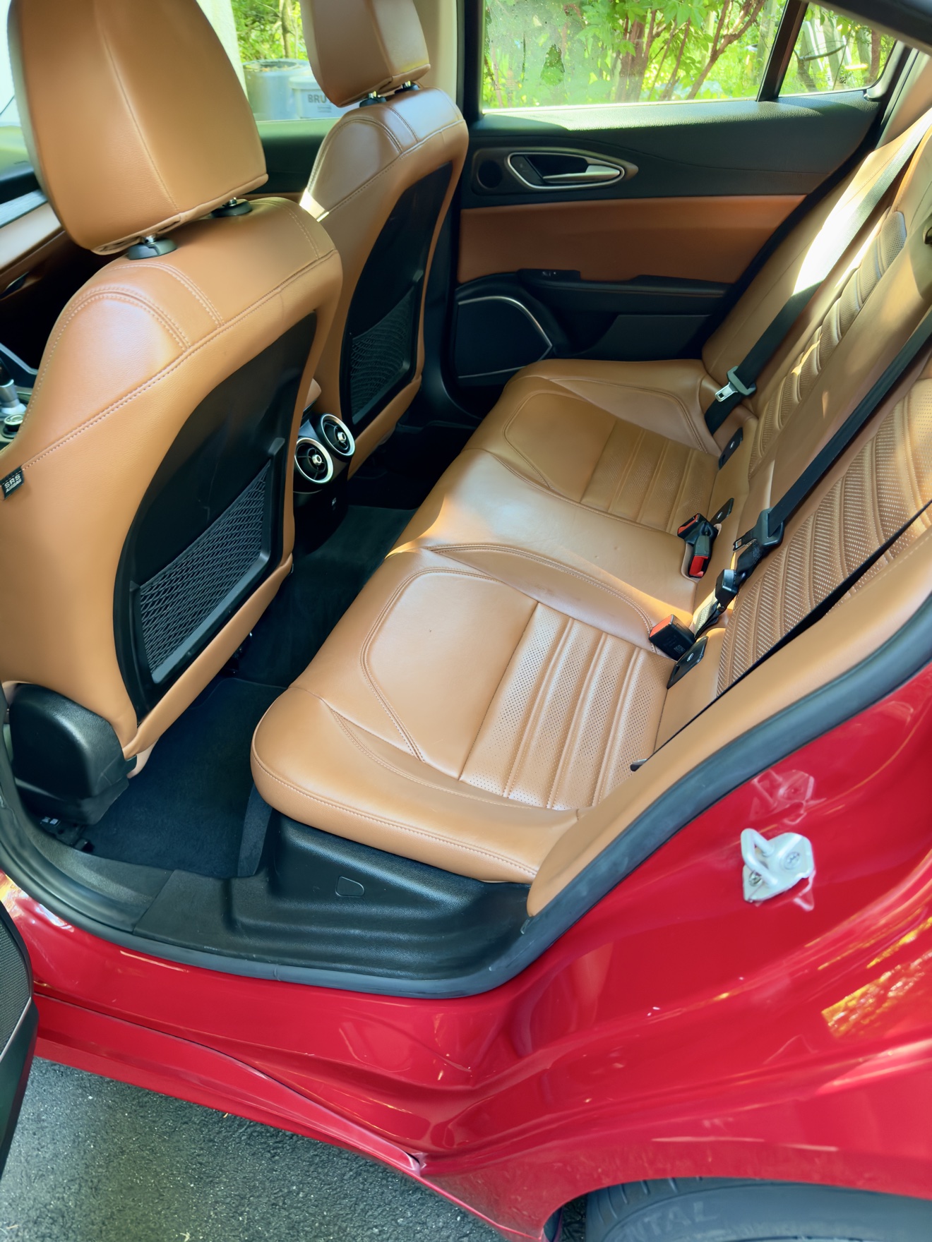 Alfa Romeo Giulia Q4 rear seats in tan leather after detailing