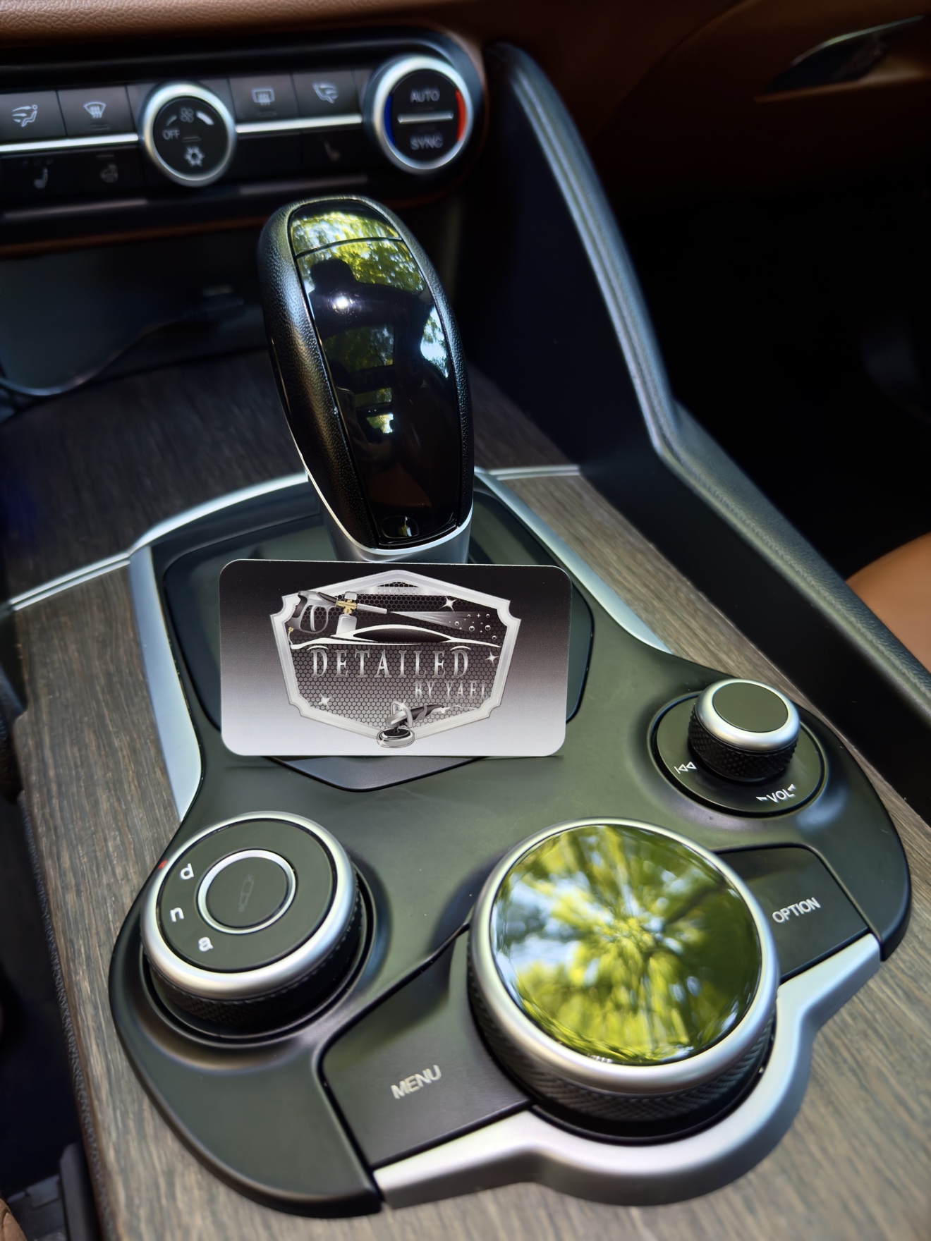 Alfa Romeo Giulia Q4 center console with Detailed by Yael business card