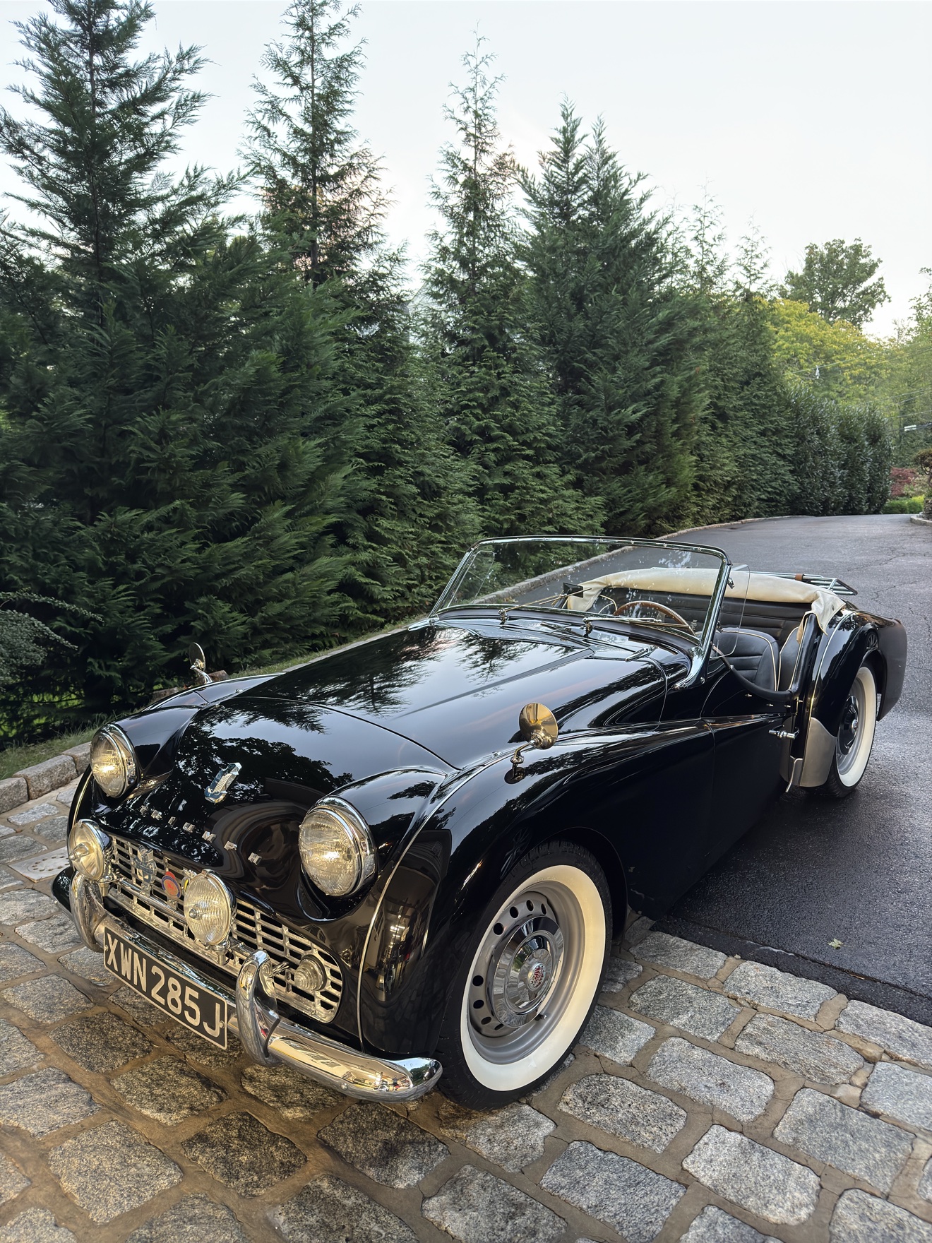 Black Triumph TR3 roadster after detailing