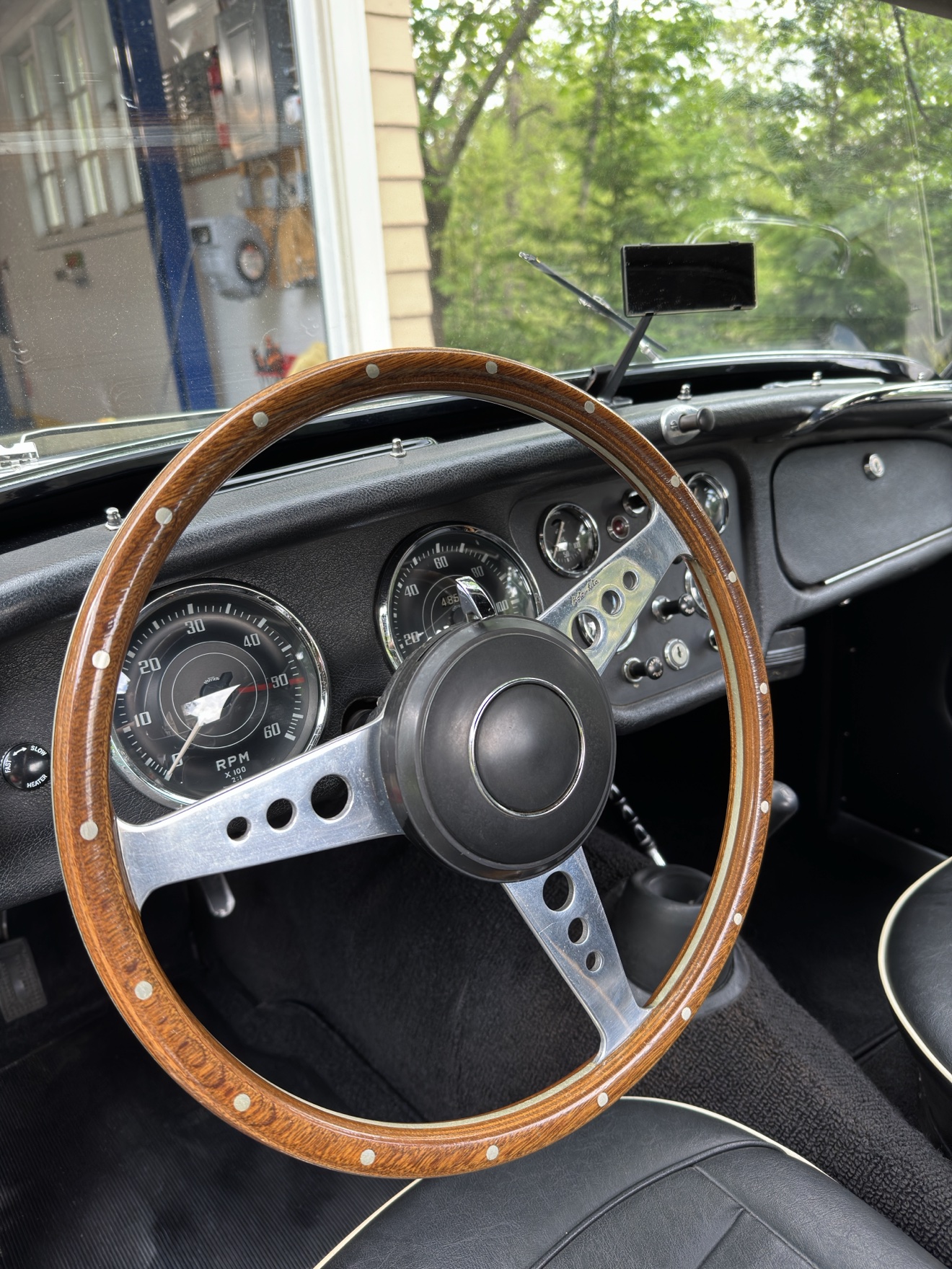 Close-up of the wood steering wheel in a Triumph TR3