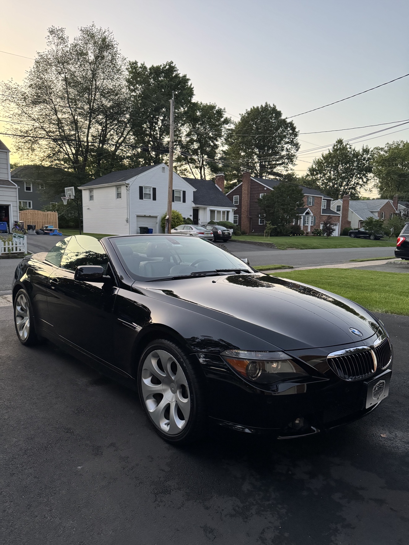 Black BMW 650i convertible front three-quarter view after detailing