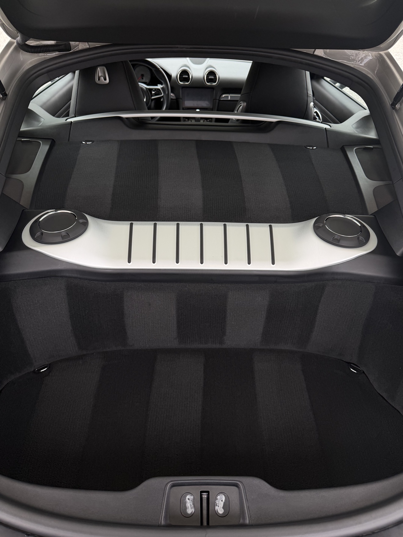 Porsche 718 Cayman S trunk with fresh carpet stripes
