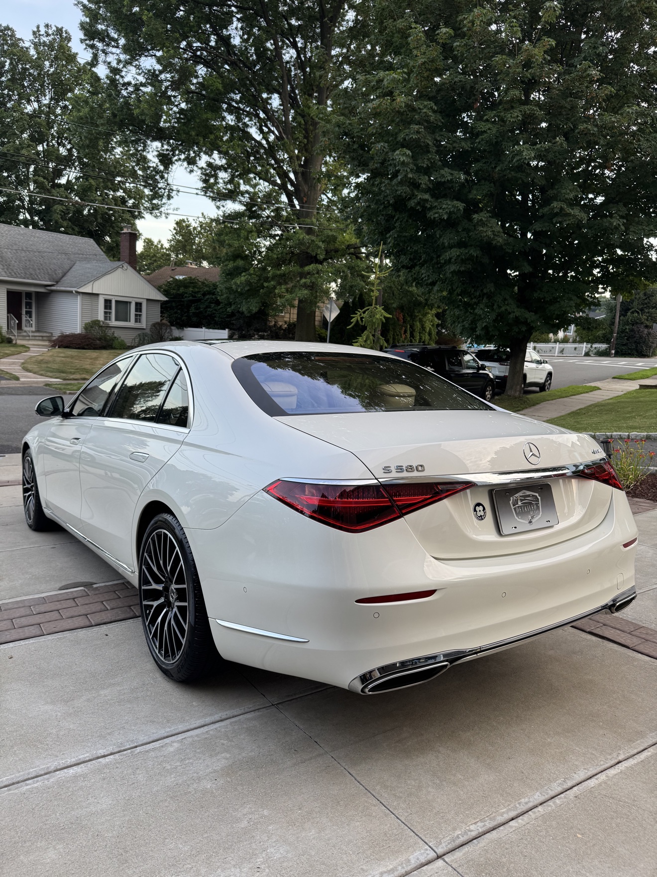 White Mercedes-Benz S580 rear three-quarter view with S 580 badge