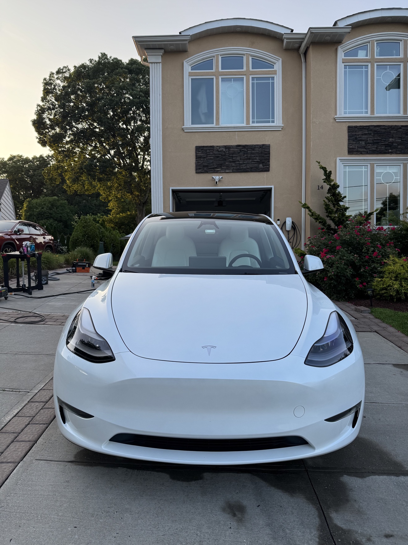Front view of a white Tesla Model Y after detailing