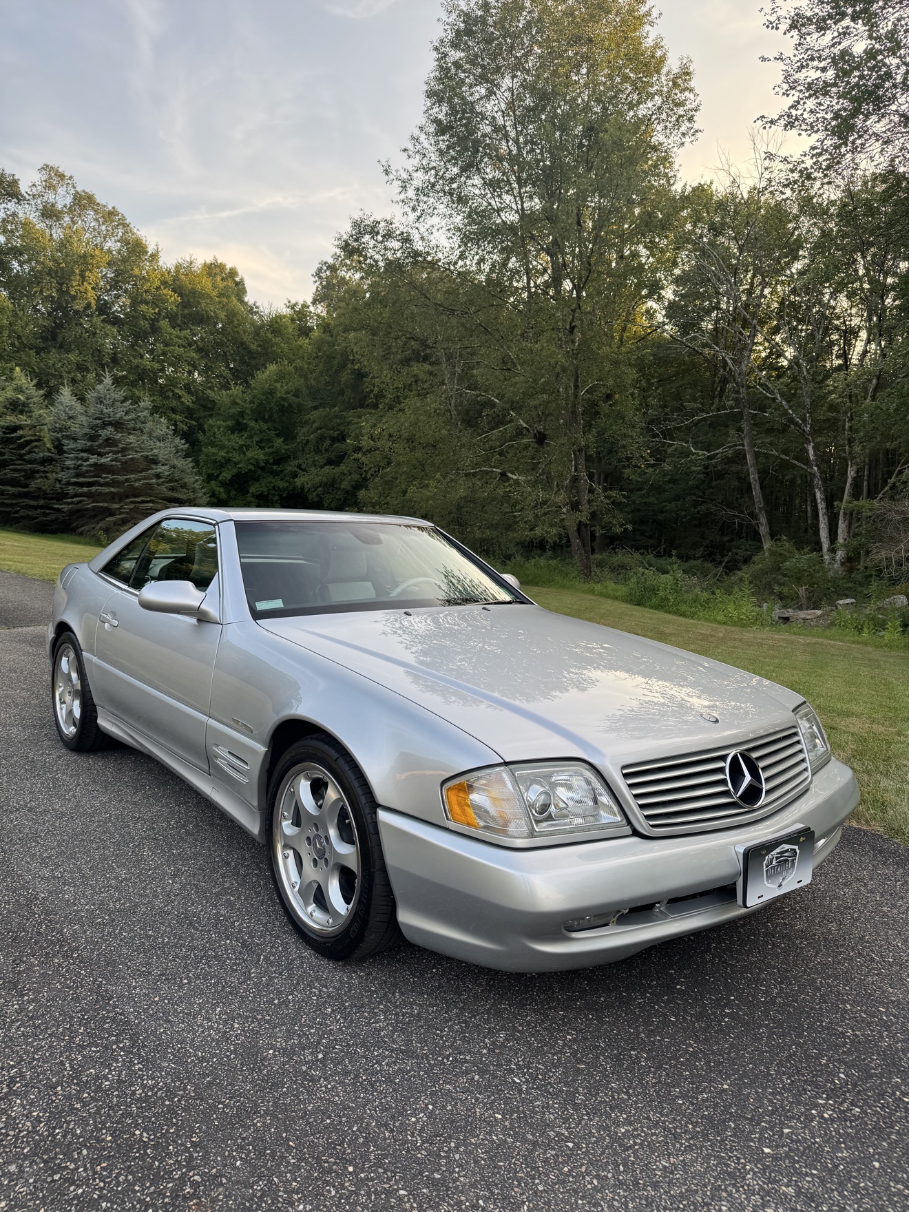 Silver Mercedes-Benz SL500 front three-quarter view after detailing