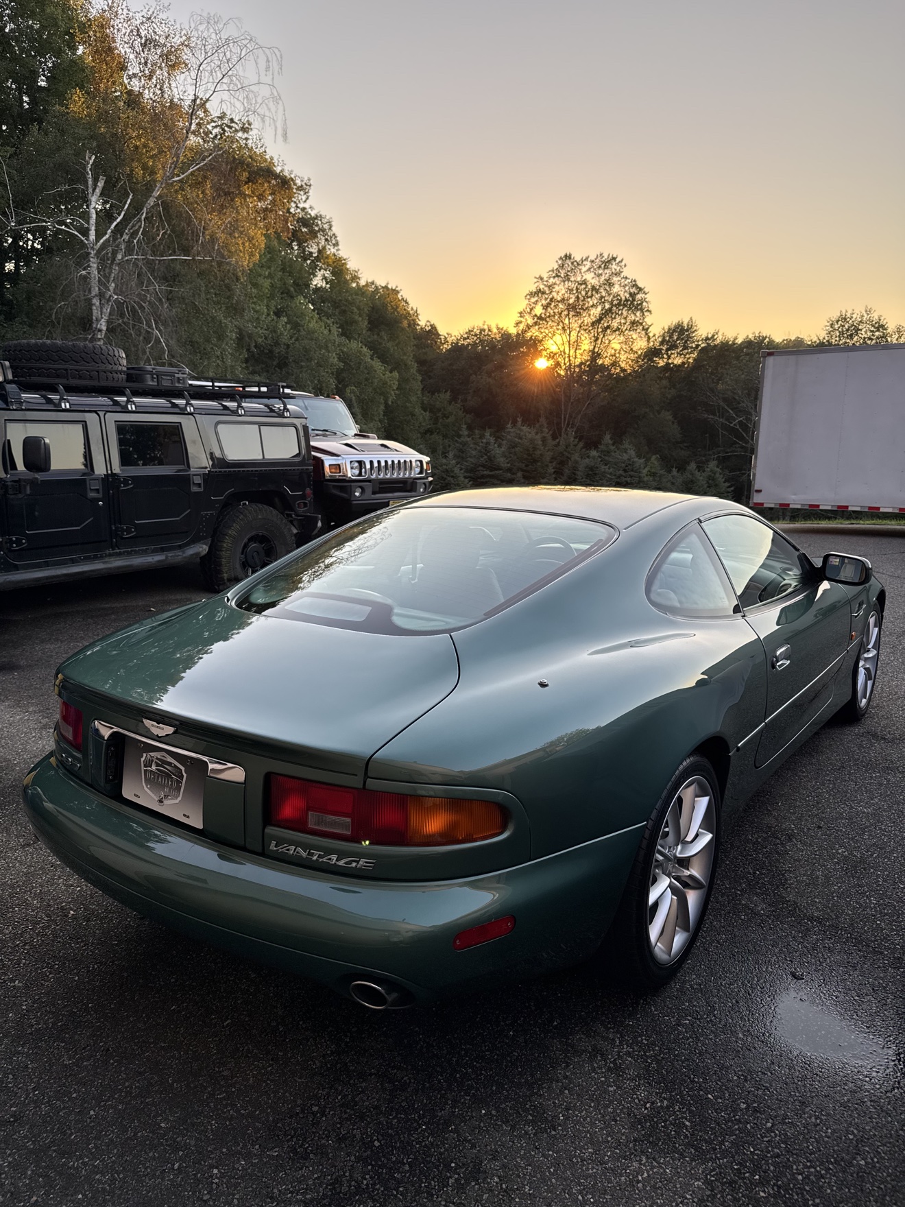 Green Aston Martin DB7 Vantage rear three-quarter view with Vantage badge