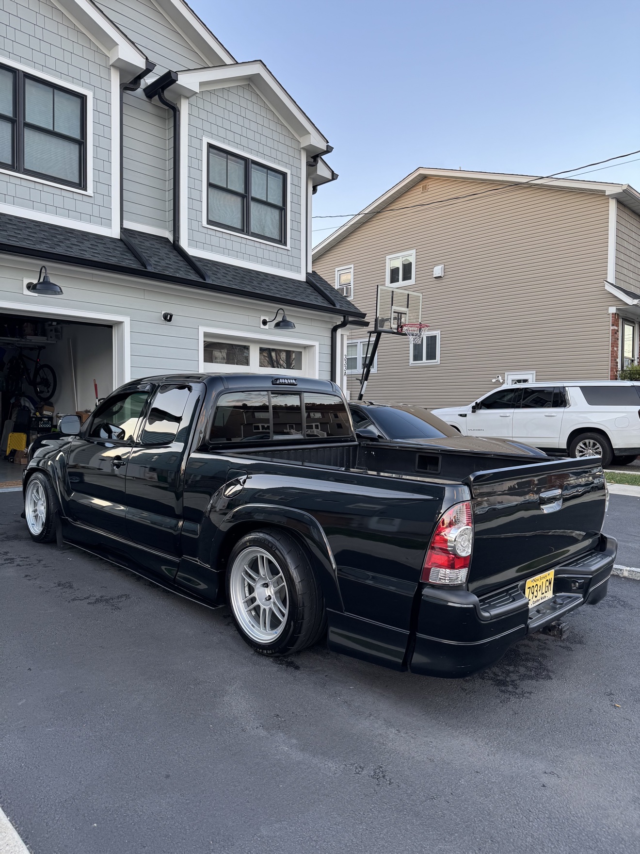 Black Toyota Tacoma X-Runner rear three-quarter view with silver wheels