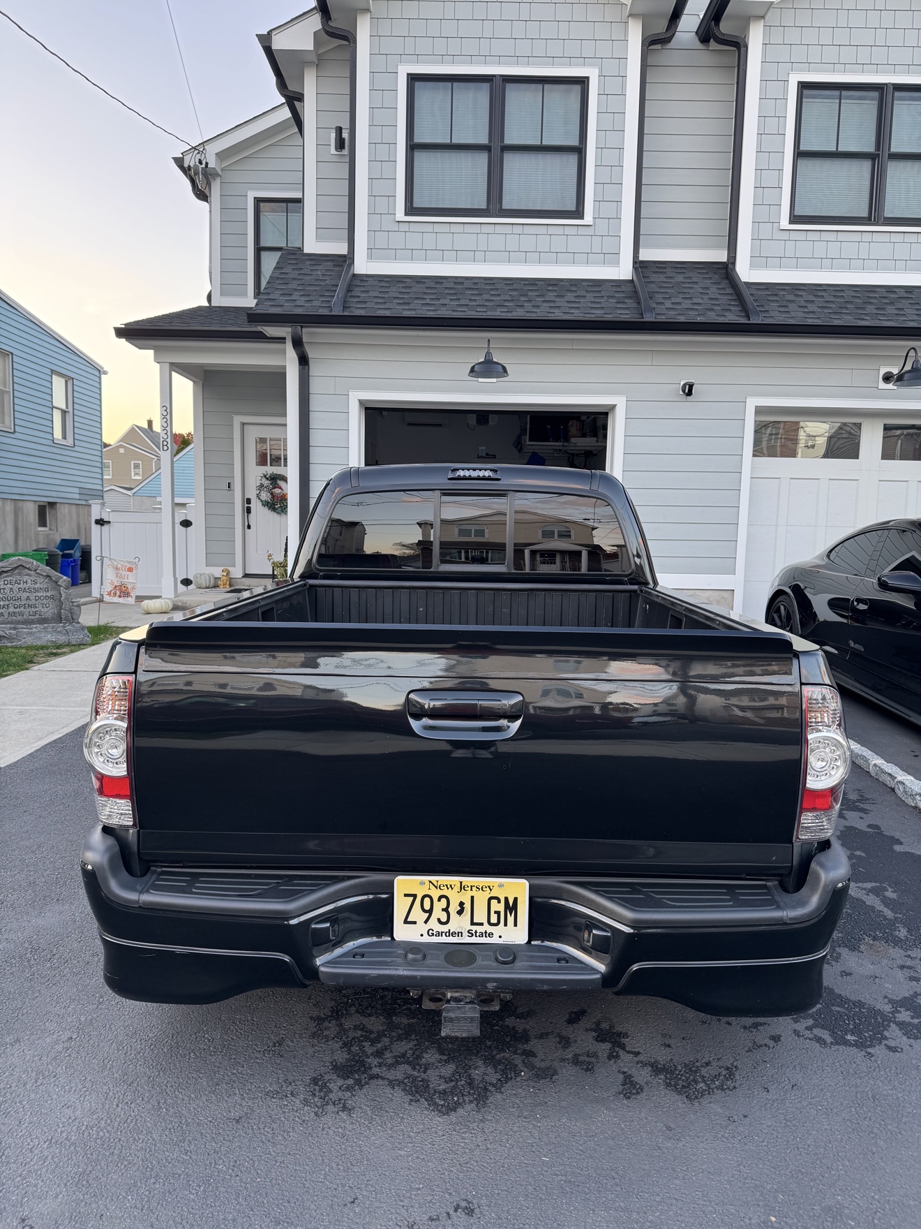 Rear view of a black Toyota Tacoma X-Runner with NJ plates
