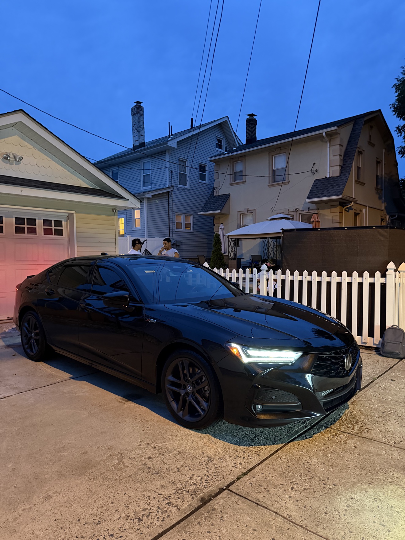 Black Acura TLX SH-AWD A-Spec front three-quarter view after detailing