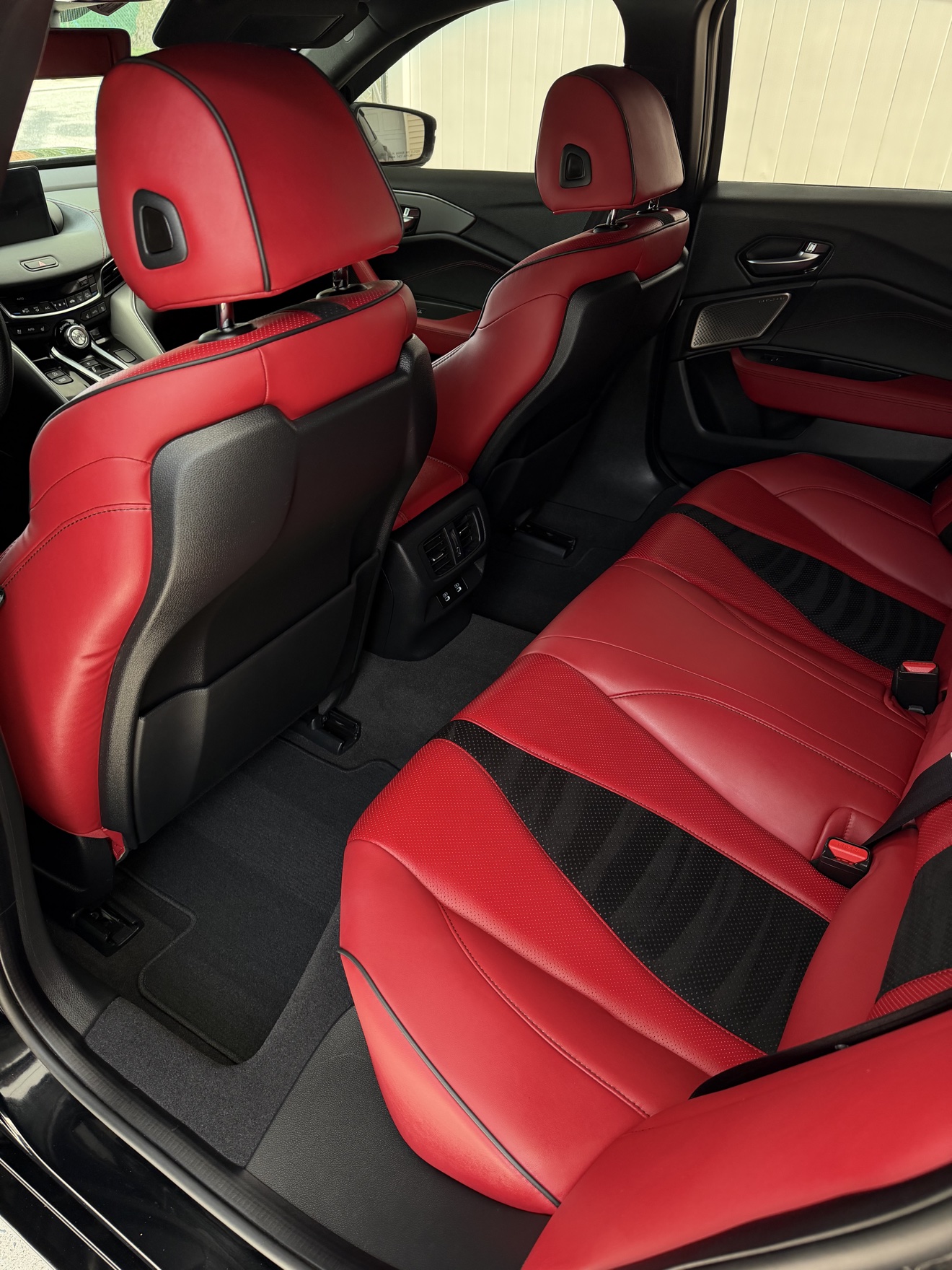 Acura TLX SH-AWD A-Spec rear seats with red and black leather after detailing