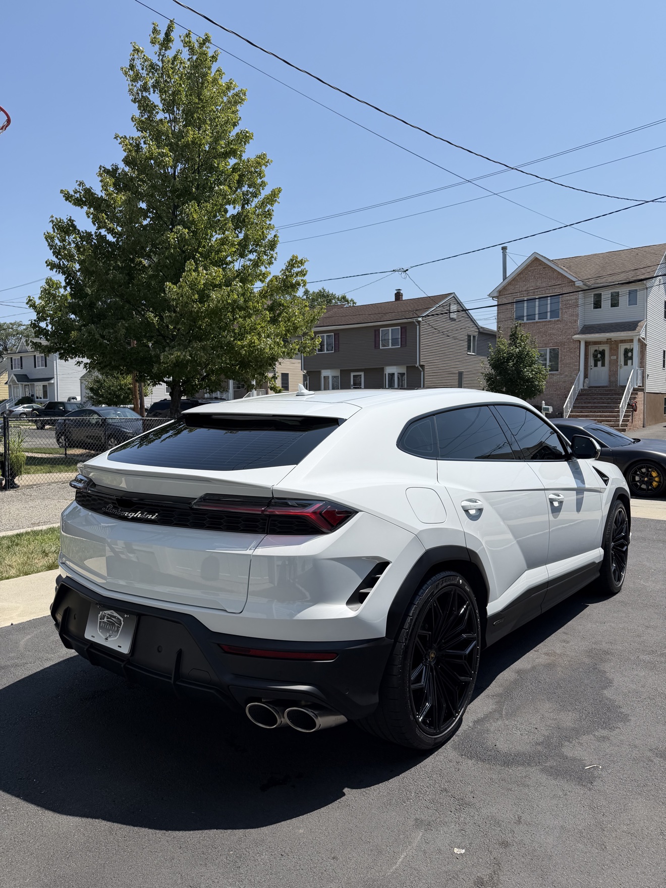 White Lamborghini Urus rear angle after detailing