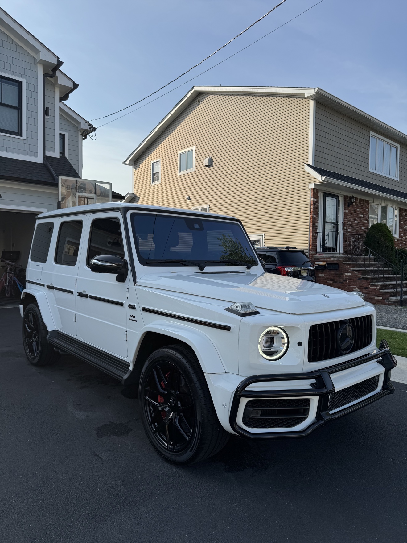 White Mercedes-AMG G 63 front three-quarter view after detailing