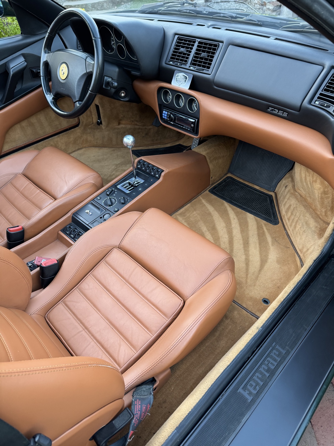 Ferrari F355 Spider cockpit with Detailed by Yael card on the dash