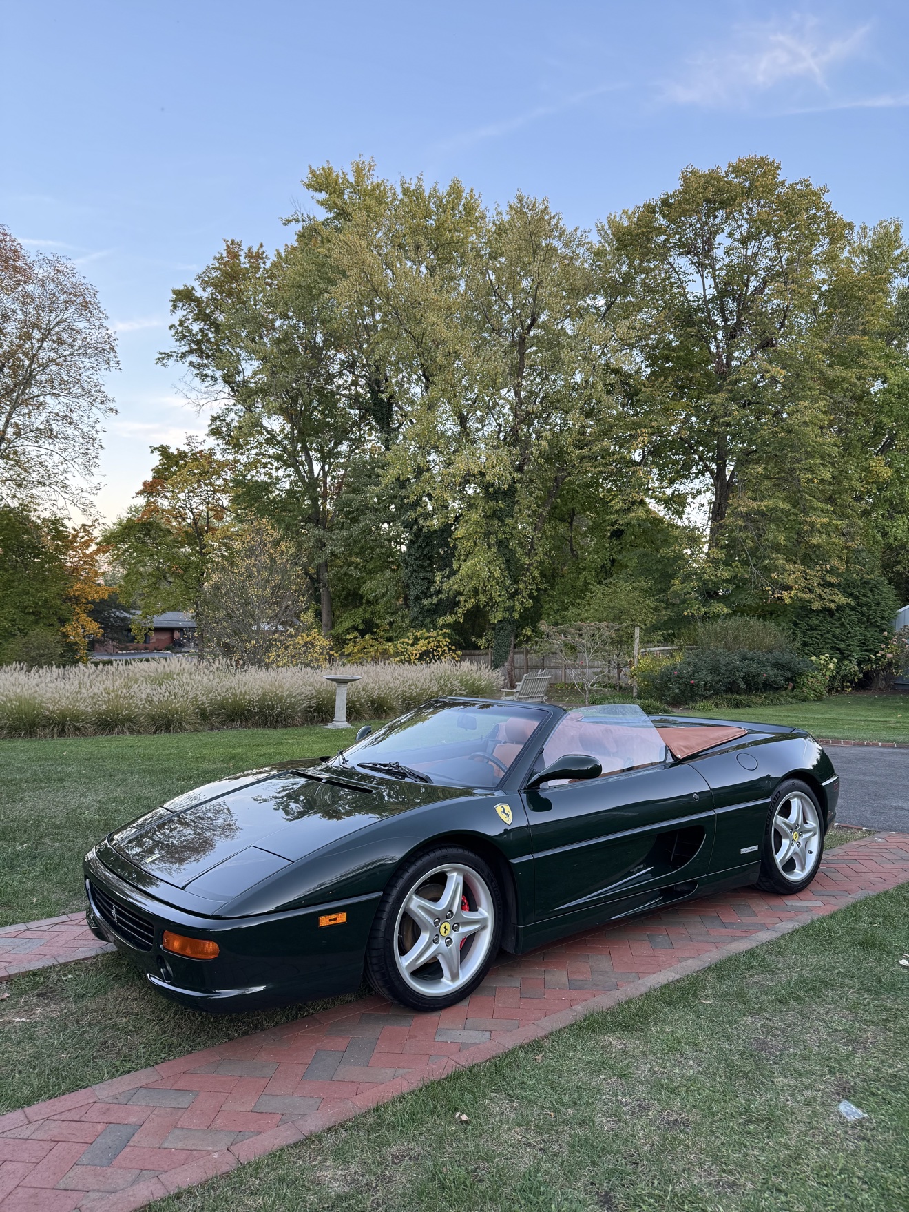 Dark green Ferrari F355 Spider wide front three-quarter view